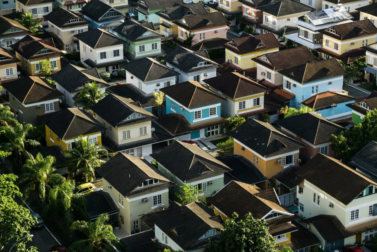 Aerial view of a dense neighborhood of two-story houses