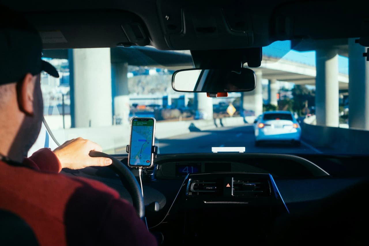 View from the back seat of a car driving on a highway